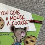 Graphic of children's book on textured gray surface