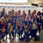 Bellmont Partners team poses in Target Field after a Twins game during wellness week