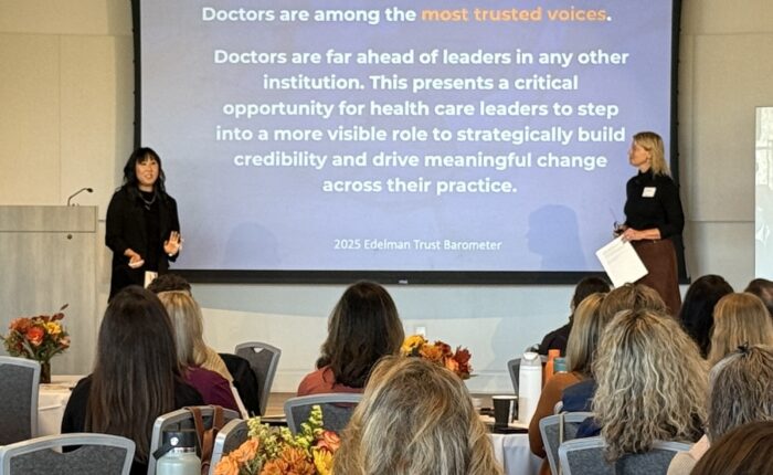 two women presenting at a conference